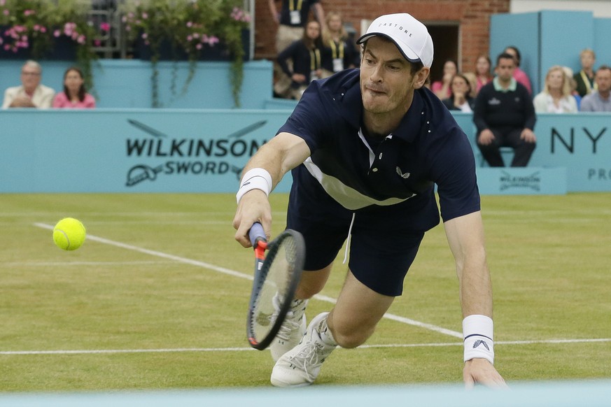 Britain&#039;s Andy Murray plays a return during his men&#039;s doubles final tennis match with Spain&#039;s Feliciano Lopez against Britain&#039;s Joe Salisbury and the United State&#039;s Rajeev Ram ...