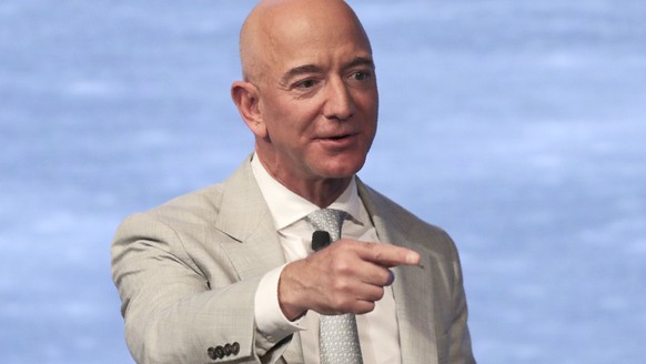 FILE - In this June 19, 2019, file photo, Amazon founder Jeff Bezos speaks during the JFK Space Summit at the John F. Kennedy Presidential Library in Boston. Bezos is one of the 50 Americans who gave  ...
