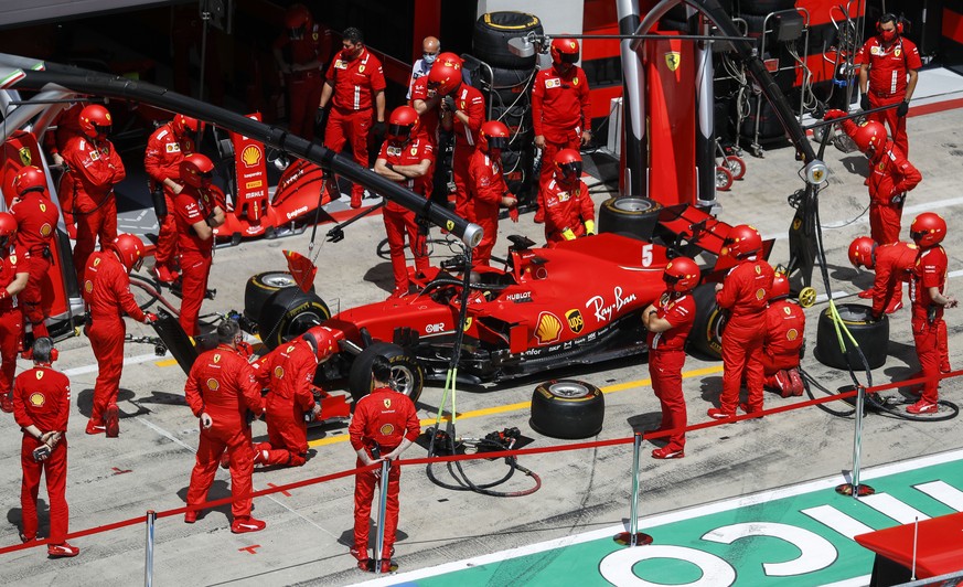 Mechanics prepare the car of Ferrari driver Sebastian Vettel prior of the Germany the Styrian Formula One Grand Prix race at the Red Bull Ring racetrack in Spielberg, Austria, Sunday, July 12, 2020. ( ...