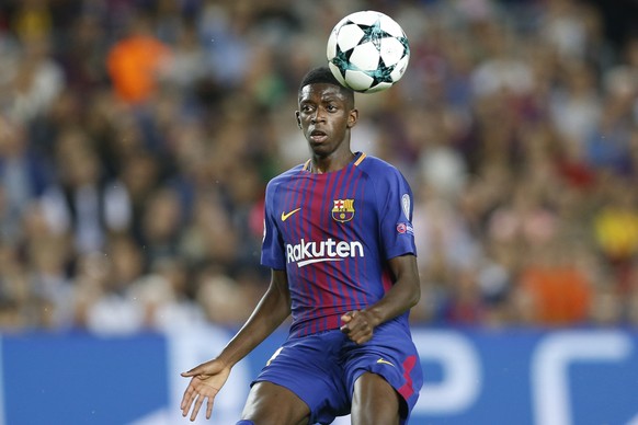 FILE - In this Sept. 12, 2017 file photo, Barcelona&#039;s Ousmane Dembele chases the ball during a Champions League group D soccer match between FC Barcelona and Juventus at the Camp Nou stadium in B ...