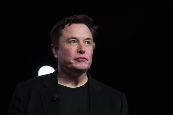 FILE - In this March 14, 2019, file photo Tesla CEO Elon Musk pauses while speaking before unveiling the Model Y at the company&#039;s design studio in Hawthorne, Calif. Musk will face the electric ca ...