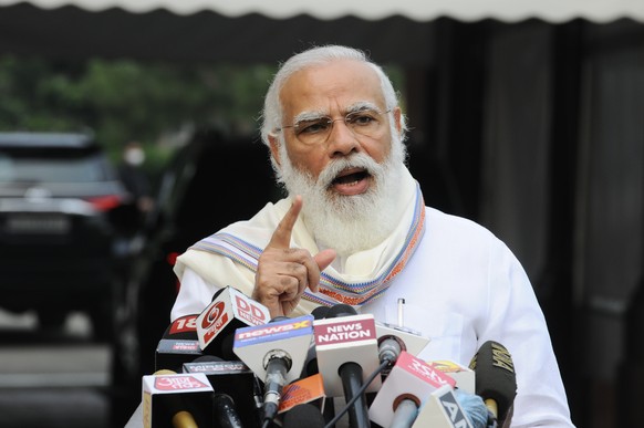 Indian Prime Minister Narendra Modi addresses the media as he arrives at the Parliament in New Delhi, India, Monday, Sept.14, 2020. Indian lawmakers have returned to Parliament after more than five mo ...