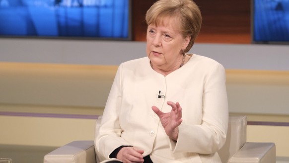 epa09103957 A handout photo made available by NDR Press and Information shows German Federal Chancellor Angela Merkel talking at &#039;Anne Will&#039; talk show at DAS ERSTE German television in Berli ...