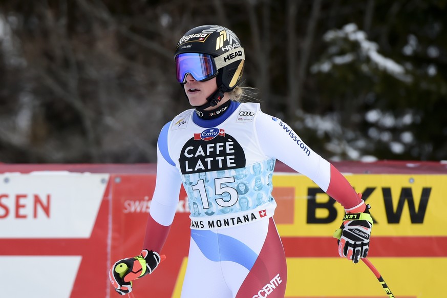 Switzerland&#039;s Lara Gut-Behrami checks her time at the finish area of an alpine ski, women&#039;s World Cup downhill in Crans Montana, Switzerland, Saturday, Jan. 23, 2021.(AP Photo/Marco Tacca)