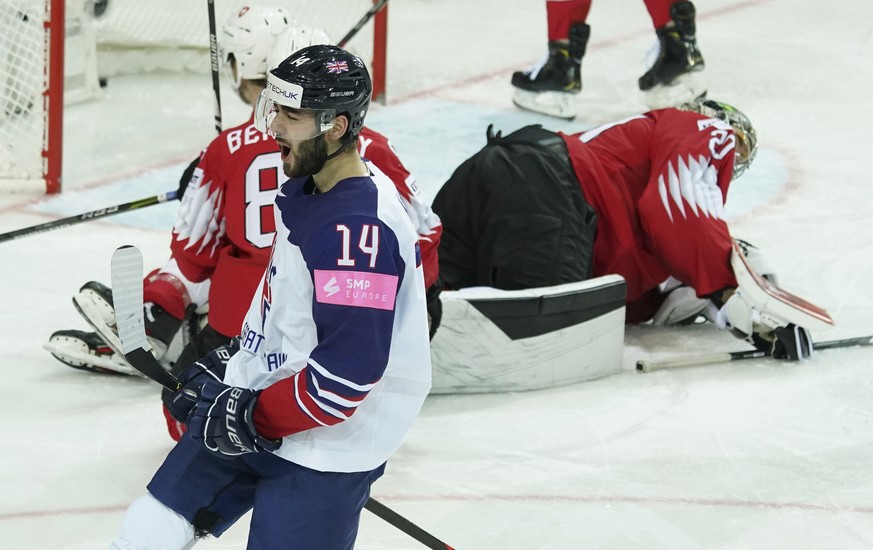 Liam Kirk of Britain celebrates a goal against Reto Berra of Switzerland during the Ice Hockey World Championship group A match between Switzerland and Britain at the Olympic Sports Center in Riga, La ...