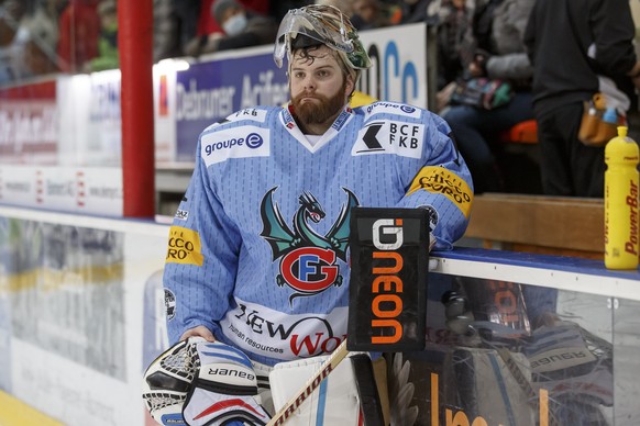Fribourg&#039;s goaltender Benjamin Conz looks on disappointed after losing against Geneve-Servette, during the game of National League A (NLA) Swiss Championship between HC Fribourg Gotteron and Gene ...