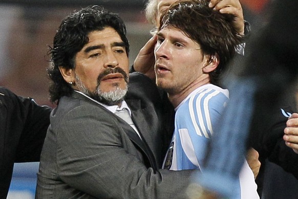 FILE - The July 3, 2010 file photo shows Argentina&#039;s Lionel Messi, right, as he is comforted by Argentina head coach Diego Maradona, left, following the World Cup quarterfinal soccer match betwee ...
