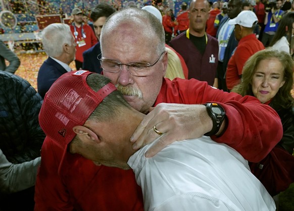Kansas City Chiefs head coach Andy Reid, rear, puts his arm around San Francisco 49ers head coach Kyle Shanahan after the Chiefs defeated the 49ers in the NFL Super Bowl 54 football game Sunday, Feb.  ...
