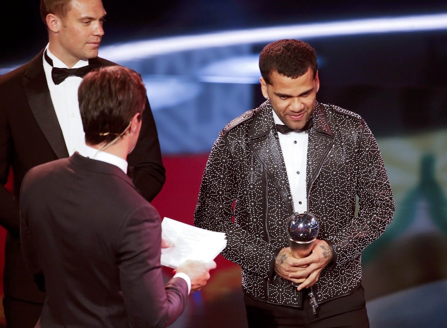 Football Soccer - FIFA Awards Ceremony - FIFA World 11 award - Zurich, Switzerland - 09/01/17. Dani Alves poses with the trophy. REUTERS/Ruben Sprich