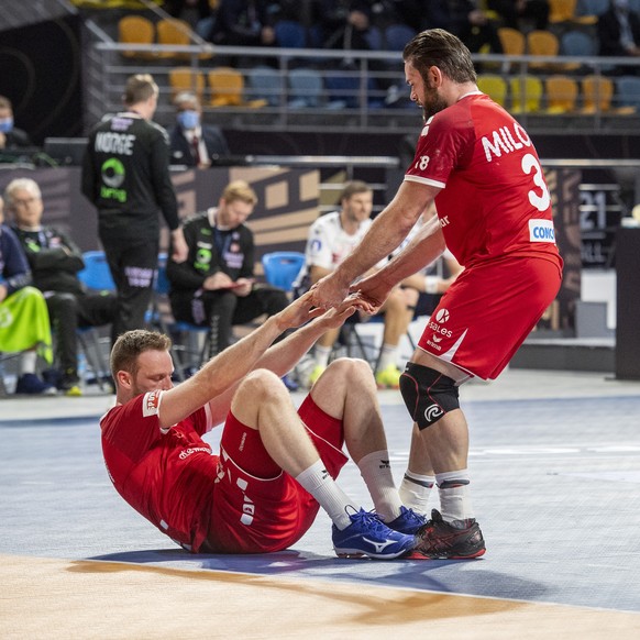 Switzerland&#039;s Lenny Rubin, left, und Alen Milosevic, right, during the 27th Men&#039;s Handball World Championship 2021 Group E match betwen Switzerland and Norway in Madinat Sittah Uktubar in Eg ...