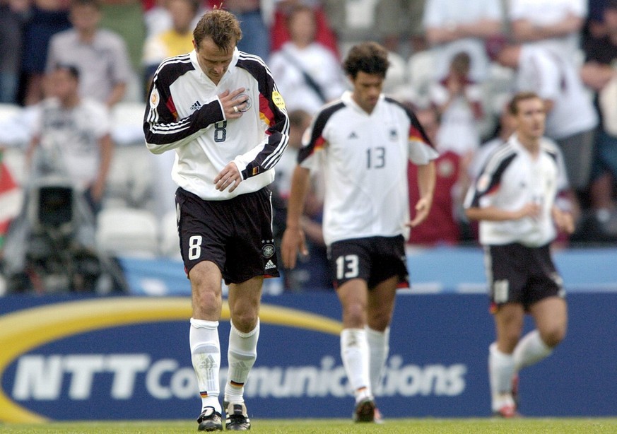 German players (from left) Dietmar Hamann, Michael Ballack and Miroslav Klose walk off the pitch after the EURO 2004 Group D match between Latvia and Germany at Bessa stadium in Porto on Saturday, 19  ...