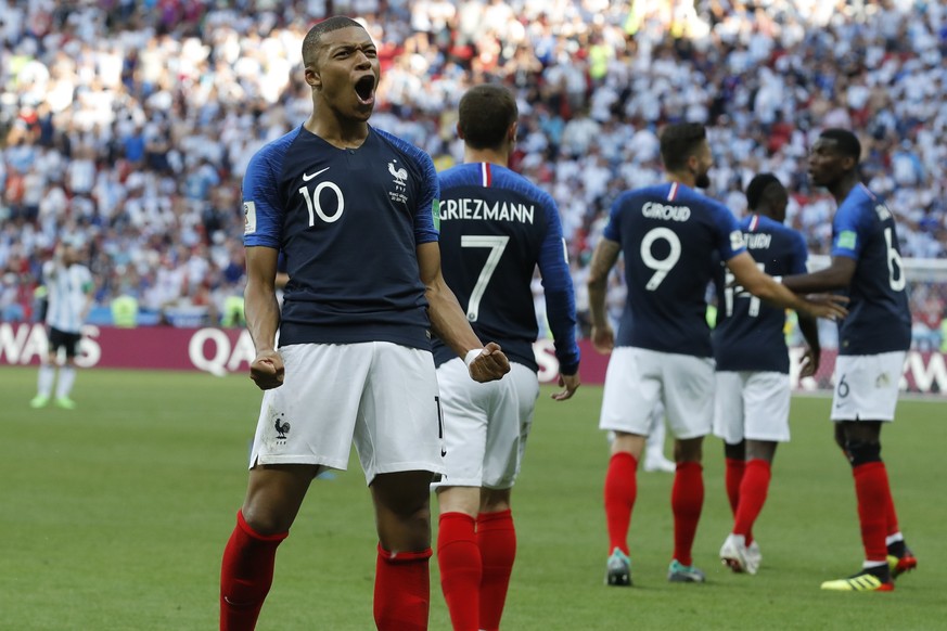 FILE - In this Saturday, June 30, 2018 file photo, France&#039;s Kylian Mbappe celebrates after scoring his side&#039;s third goal during their round of 16 match against Argentina, at the 2018 soccer  ...