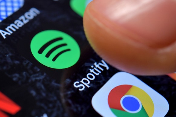 epa09044615 (FILE) - A close-up image showing the Spotify Music app on an iPhone in Kaarst, Germany, 08 November 2017 (reissued 01 March 2021). Spotify confirmed on 01 March 2021 it had removed hundre ...
