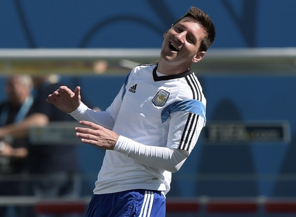 Argentina&#039;s forward Lionel Messi laughs during the official training session at The Corinthians Arena in Sao Paulo some 430kms south-west of Rio de Janeiro on June 30, 2014, ahead of their 2014 F ...