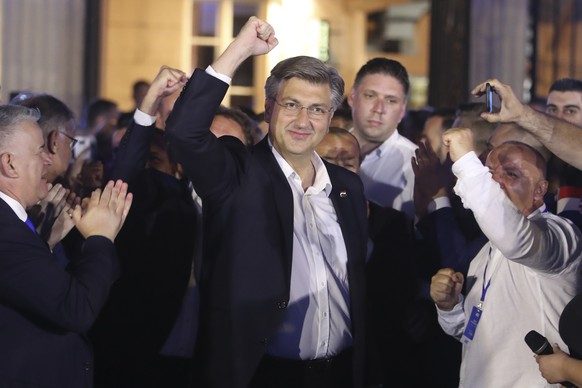 Andrej Plenkovic, Croatia&#039;s Prime Minister incumbent, center, celebrates with his party members in Zagreb, Croatia, Sunday, July 5, 2020. The ruling conservatives overwhelmingly won Croatia&#039; ...