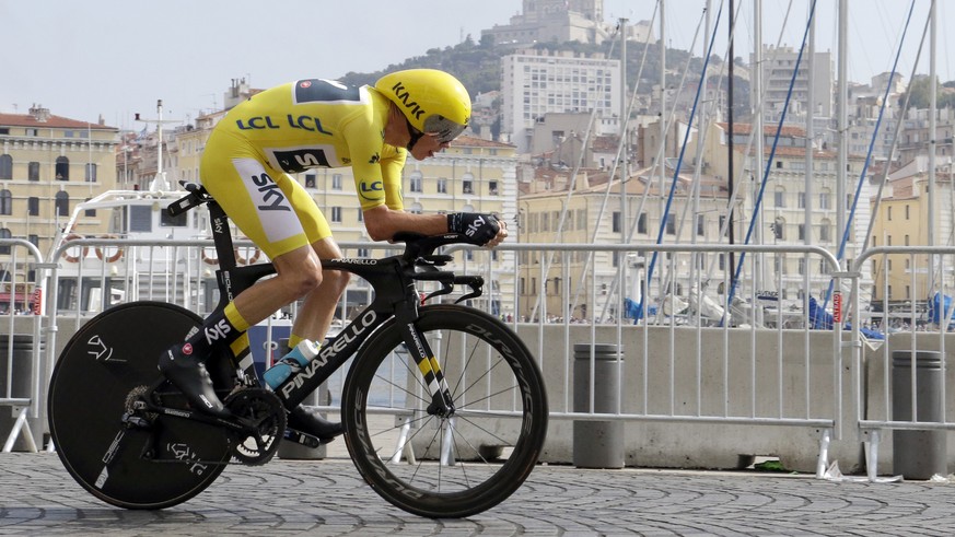 Britain&#039;s Chris Froome, wearing the overall leader&#039;s yellow jersey, competes in the twentieth stage of the Tour de France cycling race, an individual time trial over 22.5 kilometers (14 mile ...