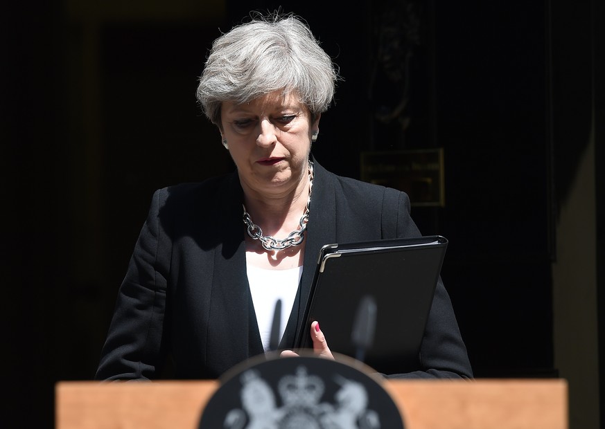 epa06036995 British Prime Minister Theresa May departs 10 Downing Street, central London, Britian, 19 June 2017, ahead of delivering a statement on the Finsbury Park Mosque attack. According to the Me ...
