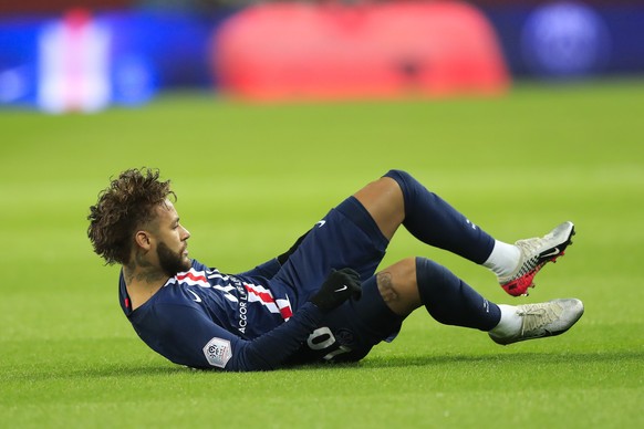 PSG&#039;s Neymar lies on the ground during French League One soccer match between Paris Saint-Germain and Lille at the Parc des Princes stadium in Paris, Friday, Nov. 22, 2019. (AP Photo/Michel Euler ...