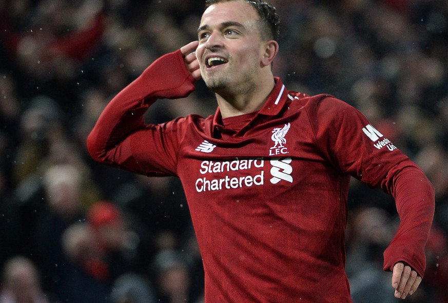 epa07236059 Xherdan Shaqiri of Liverpool celebrates after scoring the 3-1 goal during the English Premier League soccer match between Liverpool FC and Manchester United FC at Anfield in Liverpool, Bri ...
