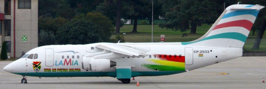 This photo released by the Bolivian Soccer Federation Tuesday, Nov. 29, 2016, shows the doomed BAE 146 Avro RJ85 LaMia jet, registration CP-2933, parked at the Viru Viru airport in Santa Cruz, Bolivia ...