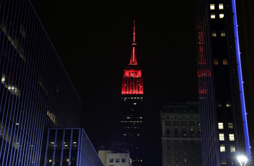 epa04476876 The Empire State Building is seen in New York, New York, USA, 04 November 2014, lit in red lights for the US Republican party which has taken over control of the US Senate from the US Demo ...