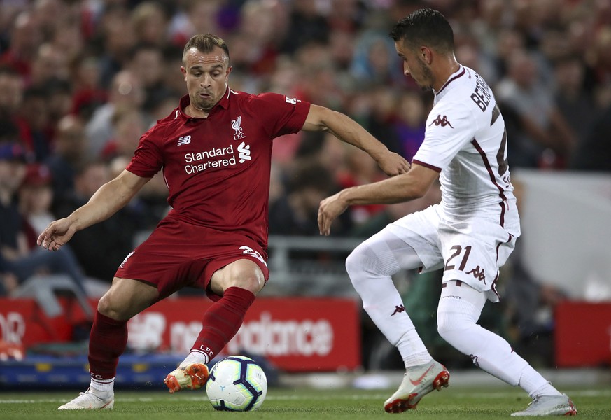 Liverpool&#039;s Xherdan Shaqiri, left, and Torino&#039;s Alex Berenguer battle for the ball during the pre-season soccer match between Torino and Liverpool at Anfield, Liverpoo, England, Tuesday, Aug ...