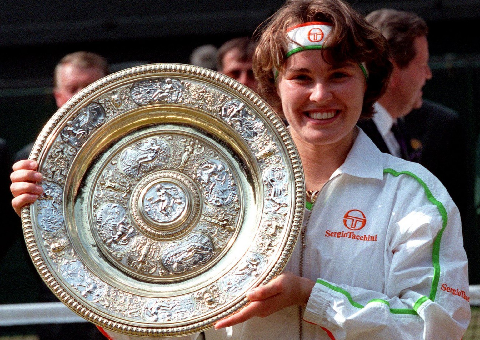 Martina Hingis holds her trophy, after defeating Jana Novotna in the Women&#039;s Singles final on the Centre Court at Wimbledon, July 5, 1997. Hingis won the final 2-6, 6-3, 6-3, to become the younge ...