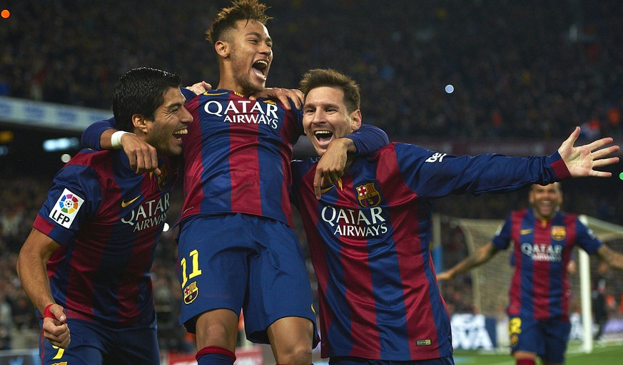 FILE - In this Sunday, Jan. 11, 2015 file photo, FC Barcelona&#039;s Lionel Messi, right, Neymar, center, and Luis Suarez, celebrate after scoring against Atletico Madrid during a Spanish La Liga socc ...