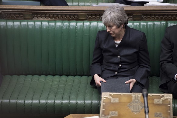 epa07499486 A handout photo made available by the UK Parliament shows British Prime Minister Theresa May after she delivered her Brexit Brussels summit statement in the House of Commons in Westminster ...