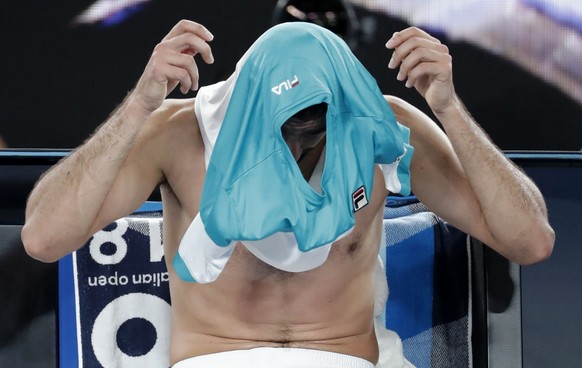 Croatia&#039;s Marin Cilic changes his shirt during a break as he plays Switzerland&#039;s Roger Federer in the men&#039;s singles final at the Australian Open tennis championships in Melbourne, Austr ...