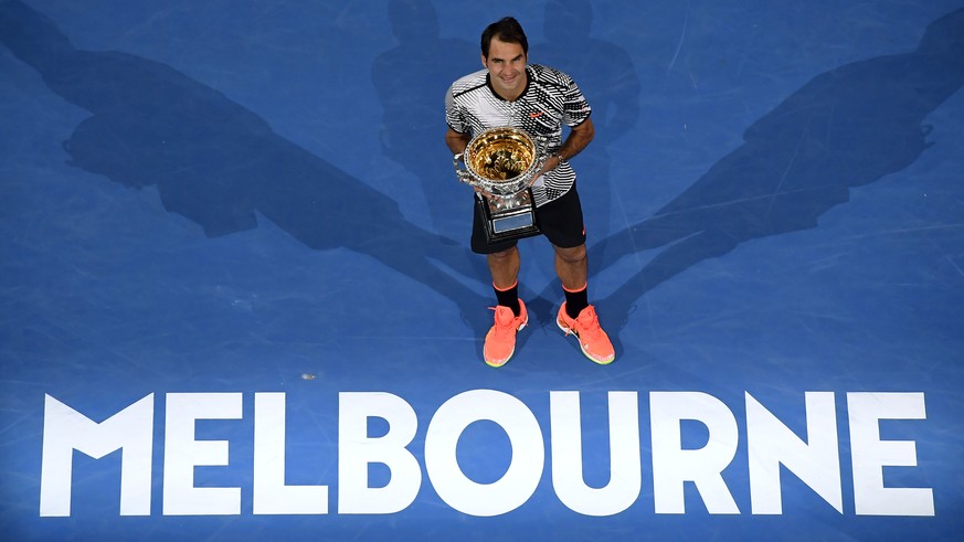 FILE - In this Jan. 29, 2017, file photo, Switzerland&#039;s Roger Federer poses with his trophy after defeating Spain&#039;s Rafael Nadal in the men&#039;s singles final at the Australian Open tennis ...