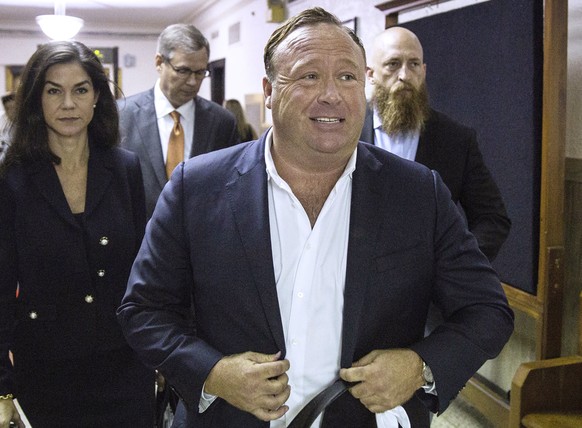 FILE - In this April 17, 2017, file photo, &quot;Infowars&quot; host Alex Jones arrives at the Travis County Courthouse in Austin, Texas. Jones filed a motion Friday, July 20, 2018, to dismiss a defam ...