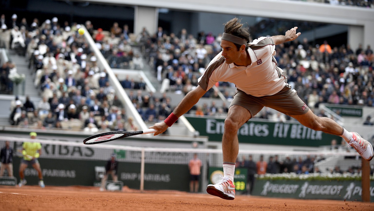 epa07632812 Roger Federer of Switzerland plays Rafael Nadal of Spain during their men’s semi final match during the French Open tennis tournament at Roland Garros in Paris, France, 07 June 2019. EPA/J ...