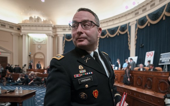 National Security Council aide Lt. Col. Alexander Vindman leaves the hearing room during a break from testifying before the House Intelligence Committee on Capitol Hill in Washington, Tuesday, Nov. 19 ...