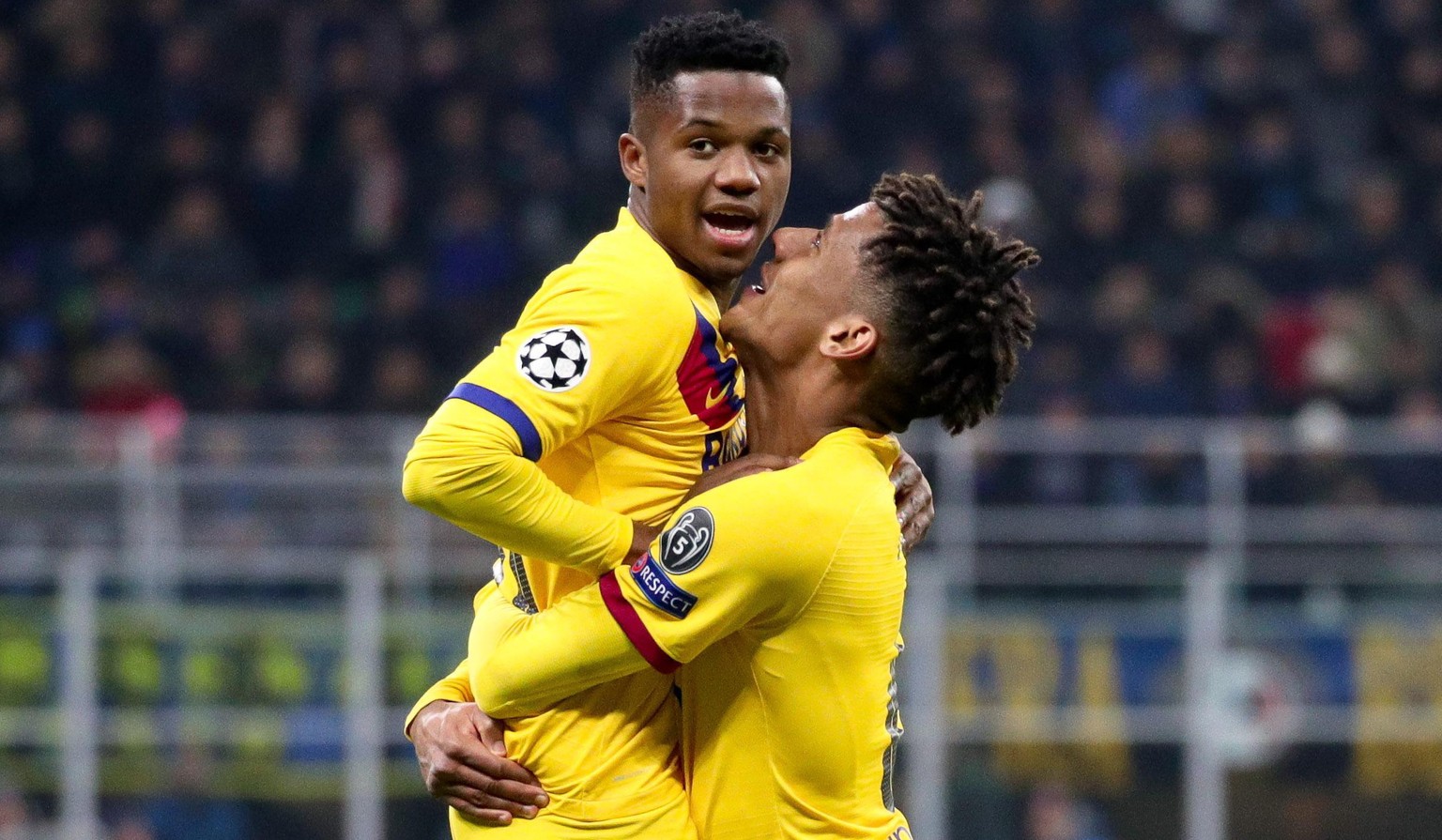 epa08061225 FC Barcelona&#039;s Ansu Fati (L) celebrates with teammate Jean-Clair Todibo after scoring during the UEFA Champions League group F soccer match between FC Inter and FC Barcelona at the Gi ...