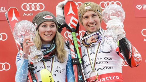 epa04672936 Mikaela Shiffrin (L) of the USA poses with her crystal globe of the women&#039;s overall Slalom World Cup title next to Marcel Hirscher (R) of Austria holding his crystal globe after winni ...