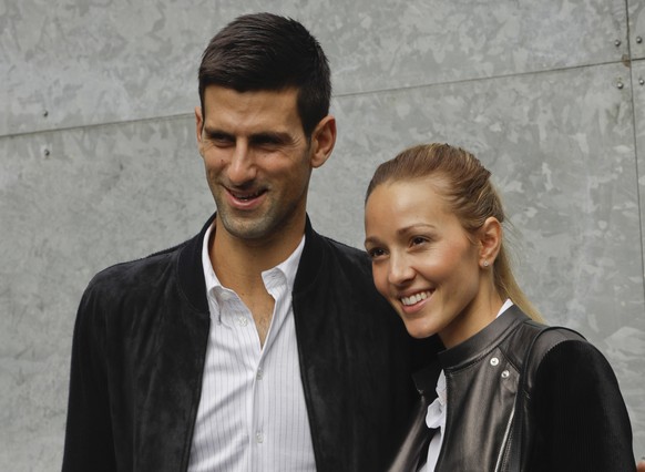 FILE - In this Friday, Sept. 23, 2016 file photo, Serbia&#039;s Novak Djokovic and his wife Jelena pose for the media prior to the start of the Giorgio Armani women&#039;s Spring-Summer 2017 fashion s ...