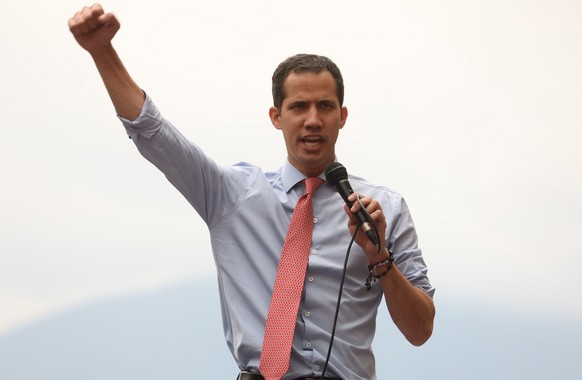 epa07432578 President of the Venezuelan Parliament Juan Guaido speaks during a rally with supporters at the Parque de Cristal park, in Caracas, Venezuela, 12 March 2019, to show rejection for the powe ...