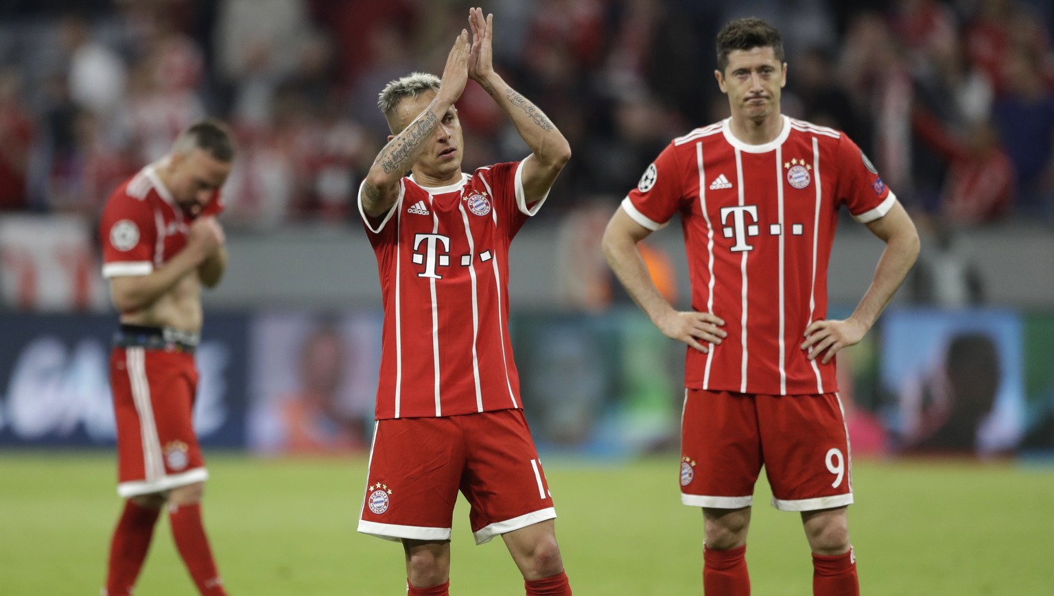 Bayern&#039;s Franck Ribery, Rafinha and Robert Lewandowski, from left, look disappointed after losing 1-2 during the semifinal first leg soccer match between FC Bayern Munich and Real Madrid at the A ...