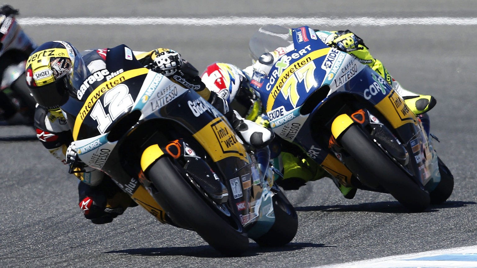 epa05275876 Swiss Moto2 rider Thomas Luethi (L), of Derendinger Interwetten, followed by countryman, Dominique Aegerter, of Technomag Interwetten, in action during the Spanish Motorcycling Grand Prix  ...