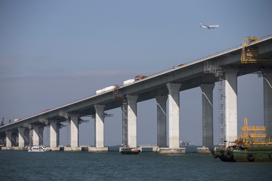 epa05733098 Construction work takes place on the Hong Kong-Zhuhai-Macau Bridge (HZMB) in Hong Kong, China, 20 January 2017. This 9 km-long section of the bridge is being built by two subsidiaries the  ...
