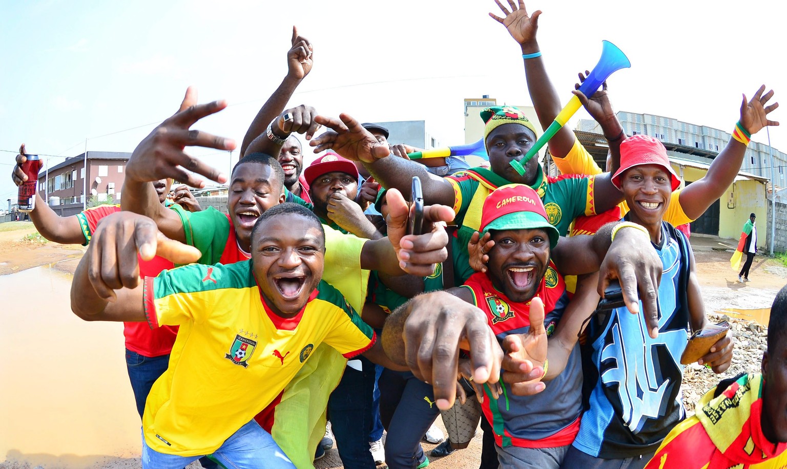 epa05773387 Cameroon fans cheer before the 2017 Africa Cup of Nations final match between Egypt and Cameroon in Libreville, Gabon, 05 February 2017. EPA/SAMUEL SHIVAMBU