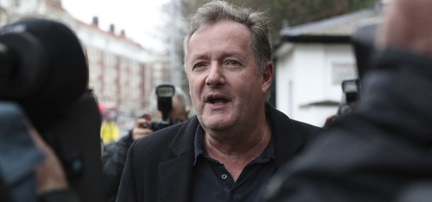 British television host Piers Morgan speaks to reporters outside his home in Kensington, central London, Wednesday March 10, 2021. Morgan quit the