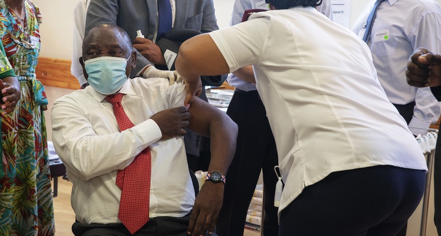 South African President Cyril Ramaphosa receives a Johnson and Johnson COVID-19 vaccine in Khayelitsha, Cape Town, South Africa, Wednesday, Feb. 17, 2021. Ramaphosa was among the first in his country  ...