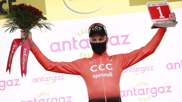 epa08634201 Swiss rider Michael Schaer of the CCC Team celebrates on the podium after being announced the most combative rider following the first stage of the Tour de France over 156km in Nice, Franc ...