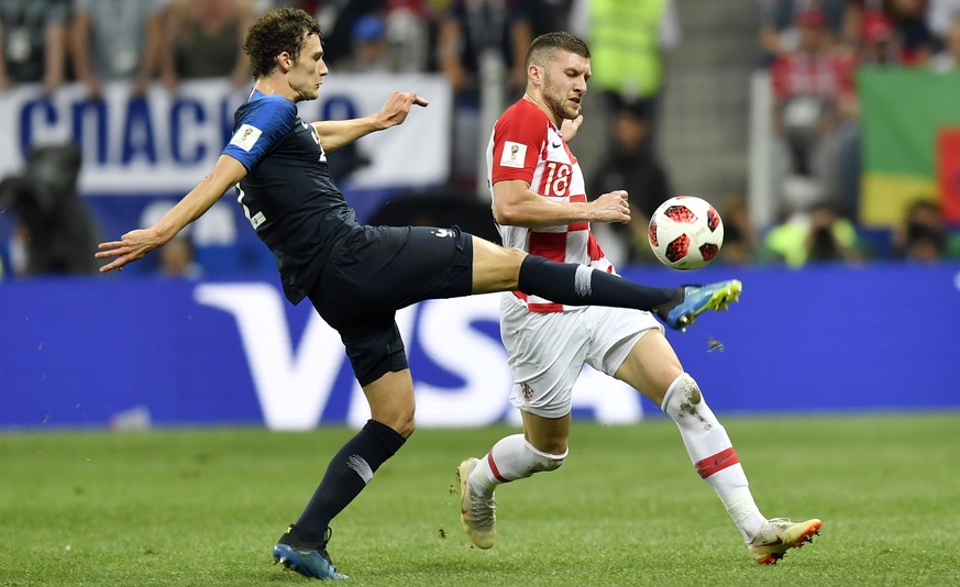 France&#039;s Benjamin Pavard, left, and Croatia&#039;s Ante Rebic challenge for the ball during the final match between France and Croatia at the 2018 soccer World Cup in the Luzhniki Stadium in Mosc ...