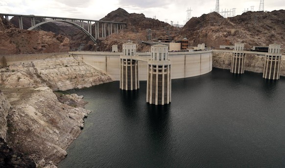 FILE - In this April 16, 2013 file photo, the high water mark for Lake Mead is seen on Hoover Dam and its spillway near Boulder City, Nev.Fearing ongoing drought and dwindling water supplies, Western  ...