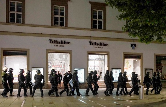epa08500385 Police officers patrol in the downtown shopping area of Stuttgart, southern Germany, 21 June 2020. According to local police, several hundreds of rioting youths vandalized and looted dozen ...