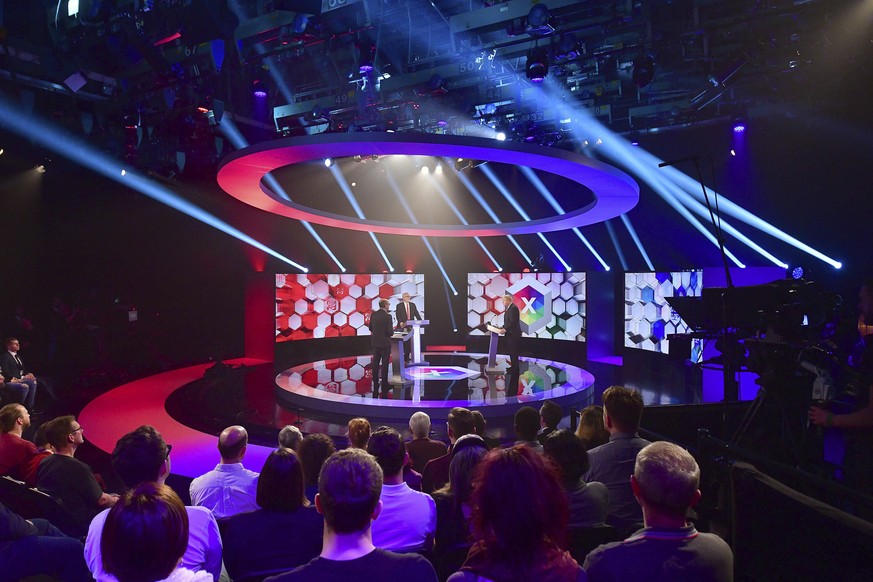 Opposition Labour Party leader Jeremy Corbyn, centre, and Britain&#039;s Prime Minister Boris Johnson, right, during a head to head live Election Debate at the BBC TV studios in Maidstone, England, Fr ...