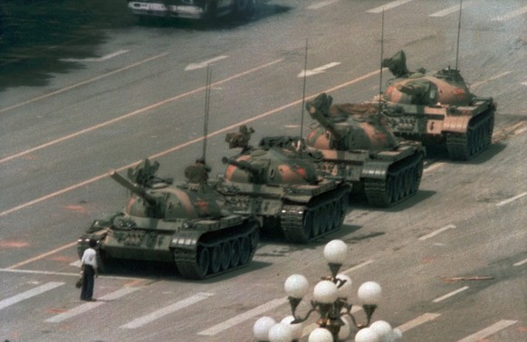 FILE - In this June 5, 1989, file photo, a Chinese man stands alone to block a line of tanks heading east on Beijing&#039;s Changan Boulevard in Tiananmen Square. The man, calling for an end to the re ...